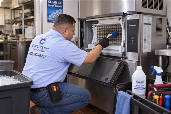 Commercial ice machine being cleaned and repaired in Dallas, TX