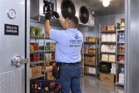 Walk-in cooler being serviced in a Dallas restaurant kitchen
